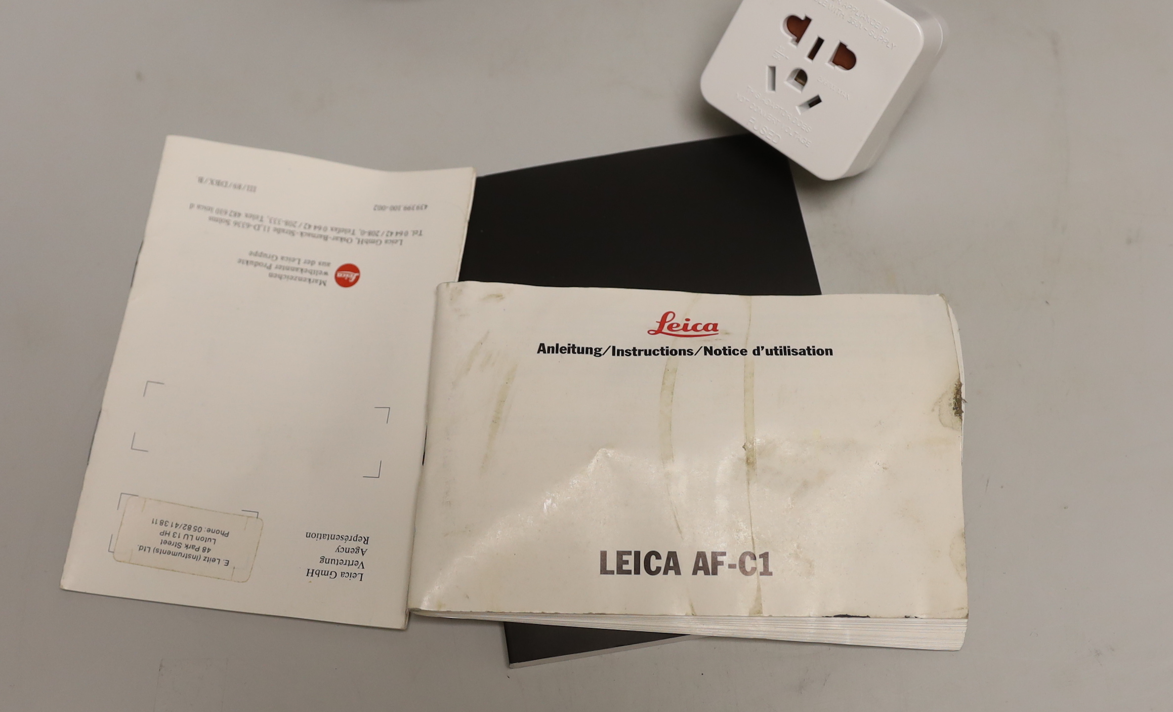 Two digital Leica cameras - a C-LUX and an AF-C1